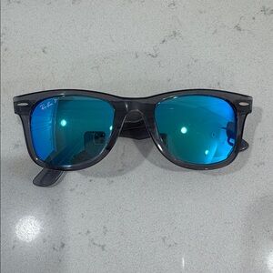 Ray-Ban Sunglasses with Black Frames and Blue Lenses